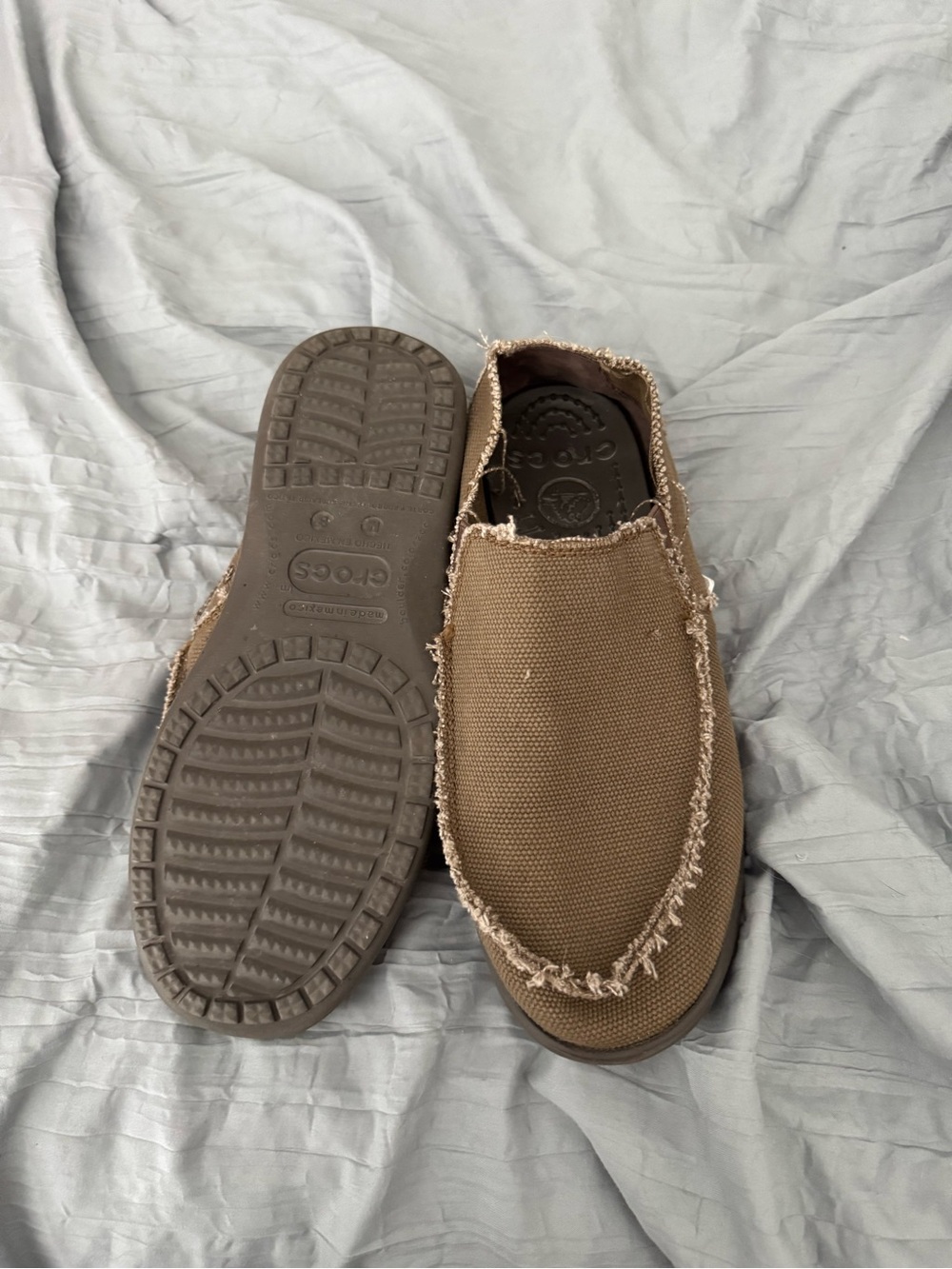 Crocs men’s Santa Cruz slip on shoes.